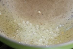 Heat oil and add garlic