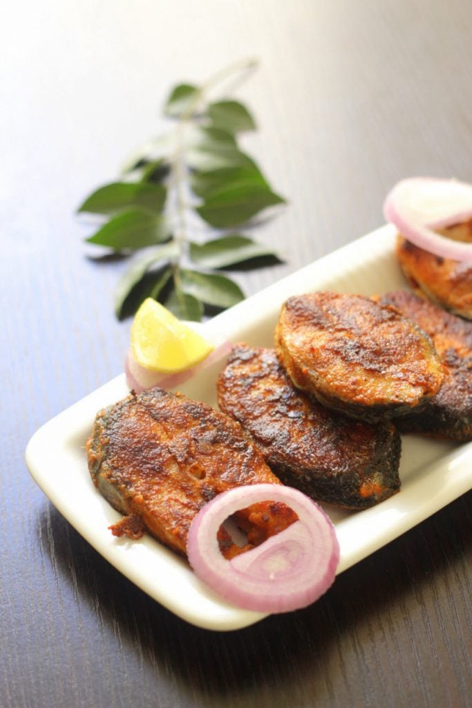 Fish fry pieces with lemon wedges