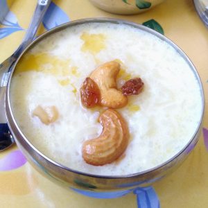Rice kheer decorated with cashews and raisins